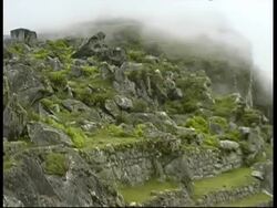 Machu Picchu, pan right from terrace to river, MS, Peru Stock Footage