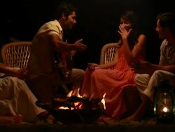 Family enjoying music at campfire  Stock Footage