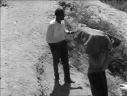 B/W 1967 high angle PAN Arabs carrying packs on back leaving Jerusalem after Six Day War / newsreel Stock Footage