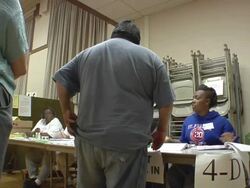 MS, People signing in at registration table at polling place, Toledo, Ohio, USA Stock Footage
