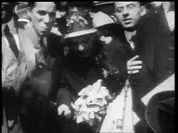 B/W 1910s Mary Pickford + Charlie Chaplin greeting fans + blowing kisses / World War I / newsreel Stock Footage