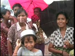 German philanthropist buying rice and delivering it to villages News Clip