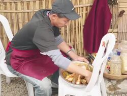 MS Shot of man preparing seafood at Kohima, Nagaland, India Stock Footage
