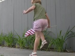 Patriotic Child: Dancing while Waving USA Flag Stock Footage