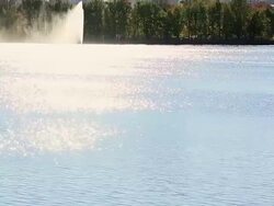 WS PAN TU View of autumn color trees and Manhattan skyline at reservoir illuminated by sunlight / New York, United States Stock Footage