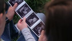 Watching the baby ultrasound picture Stock Footage