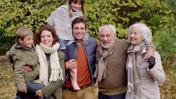 Multi-generational family walking in woods Stock Footage