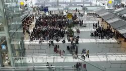 Crowd of travelers at airport terminal check-in area Stock Footage