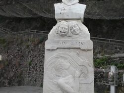 Aci Castello, view of the Giacinta Pezzana monument in front of the castle Stock Footage