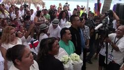 CLEAN : Acapulco holds mass gay wedding on beach News Clip