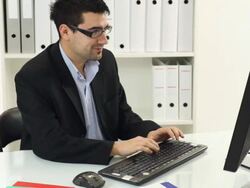 Young businessman working in office Stock Footage