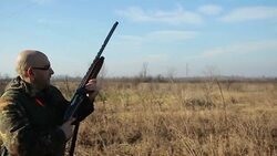 Hunter shooting at a target,slow motion Stock Footage