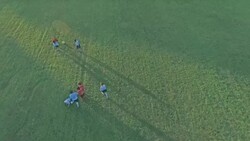 Aerial view of children playing soccer Stock Footage