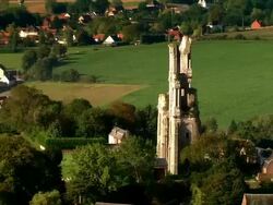 AERIAL old church ruins in residential area/ Arras, France Stock Footage