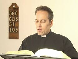 Vicar / Priest reading The Bible Stock Footage