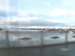 WS View of Crossing bridge over river and Containing moored boats / Archangelsk, Archangelsk Oblast, Russia  Stock Footage