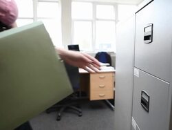 Female office worker filing Stock Footage