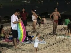 CLEAN:Rio residents head to beach at night to escape heat News Clip