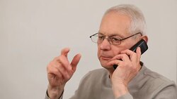 Man talking on phone in animated  fashion talking with hands Stock Footage