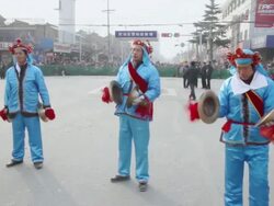MS PAN Villagers performing gongs and drums in traditional festive folk celebration or carnival during chinese spring festival  AUDIO  / xi'an, shaanxi, china Stock Footage