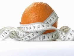 HD: Orange Wrapped In Measuring Tape Stock Footage