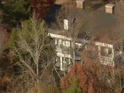 CU AERIAL ZI Shot of wood burn plantation house at 130 history lane surrounded by trees / South Carolina, United States Stock Footage