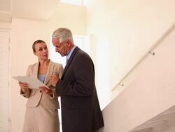 Estate agent showing buyer around Stock Footage