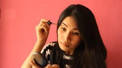 Girl making up Stock Footage