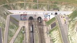 Aerials of EuroTunnel trains entering tunnel News Clip