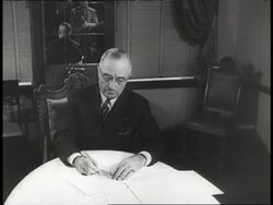 United States President Harry S. Truman signs the Truman Doctrine in 1947. News Clip