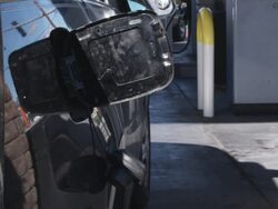 A man pumping gas, focus on hand Stock Footage