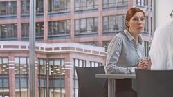 DS Female project analyst in meeting with the manager Stock Footage