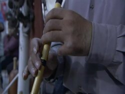 Mans hands playing the Ney, a persian flute, in the House of Strength, Esfahan, Iran (sound available) Stock Footage