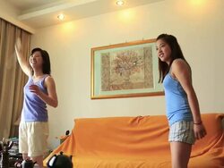 Young women playing TV game actively in the room Stock Footage