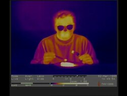 Thermographic imaging, MCU man eating hot pie Stock Footage