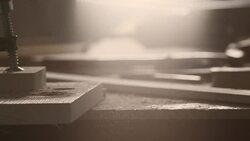 Wooden plank falling down on table in workshop Stock Footage