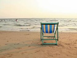 HD Dolly:bench on the beach Stock Footage