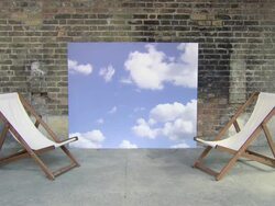 Deckchairs and sky backdrop, teenage couple enter and sit on deckchairs Stock Footage