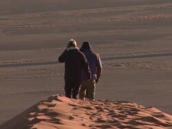 People walking on sand dune, Sossusvlei, Namib-Naukluft, Namibia Stock Footage