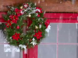 CU Christmas wreath hanging on window during winter / Tweed, Ontario, Canada Stock Footage