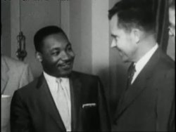 Martin Luther King Jr and Vice President Richard Nixon shake hands. News Clip