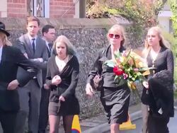 Guests arrive at Peaches Geldof Funeral at St Mary Magdalene & St Lawrence Church on April 21, 2014 in Faversham, England. Stock Footage