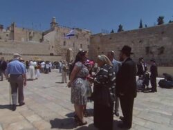 WS ZI ZO Family standing in courtyard of  Wailing Wall  AUDIO / Jerusalem,  Jerusalem, Israel Stock Footage