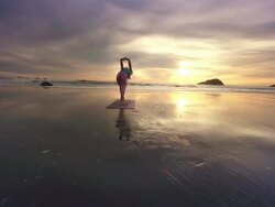 WS POV ZI Woman doing yoga on beach / Bandon, OR, United States  Stock Footage