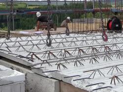 MS Shot of workmen working on house building at construction site / Hermeskeil, Rhineland Palatinate, Germany Stock Footage