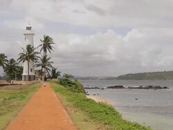 WS View of Pathway leading to lighthouse inside Galle Fort / Galle, Southern Province, Sri Lanka Stock Footage