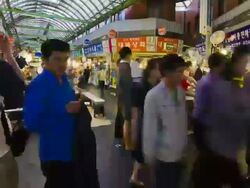 MS T/L PAN People roaming in Gwangjang Food Market / Seoul, South Korea Stock Footage