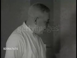 1948: HOSPITAL ANESTHETIST: Male anesthetist at nurse's station w/ chart. DRAMATIZATION: Male anesthetist in hospital room talking w/ 'Mrs. Conrad' SOT telling her not to worry about tomorrow. Male anesthetist walking out of room, talking w/ doctor. Instructional Video