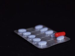 HD SLOW MOTION: Pills Falling Over A Blister Pack Stock Footage