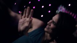 Hollywood couple in limousine wave to fans and hold up awards trophy at awards show Stock Footage